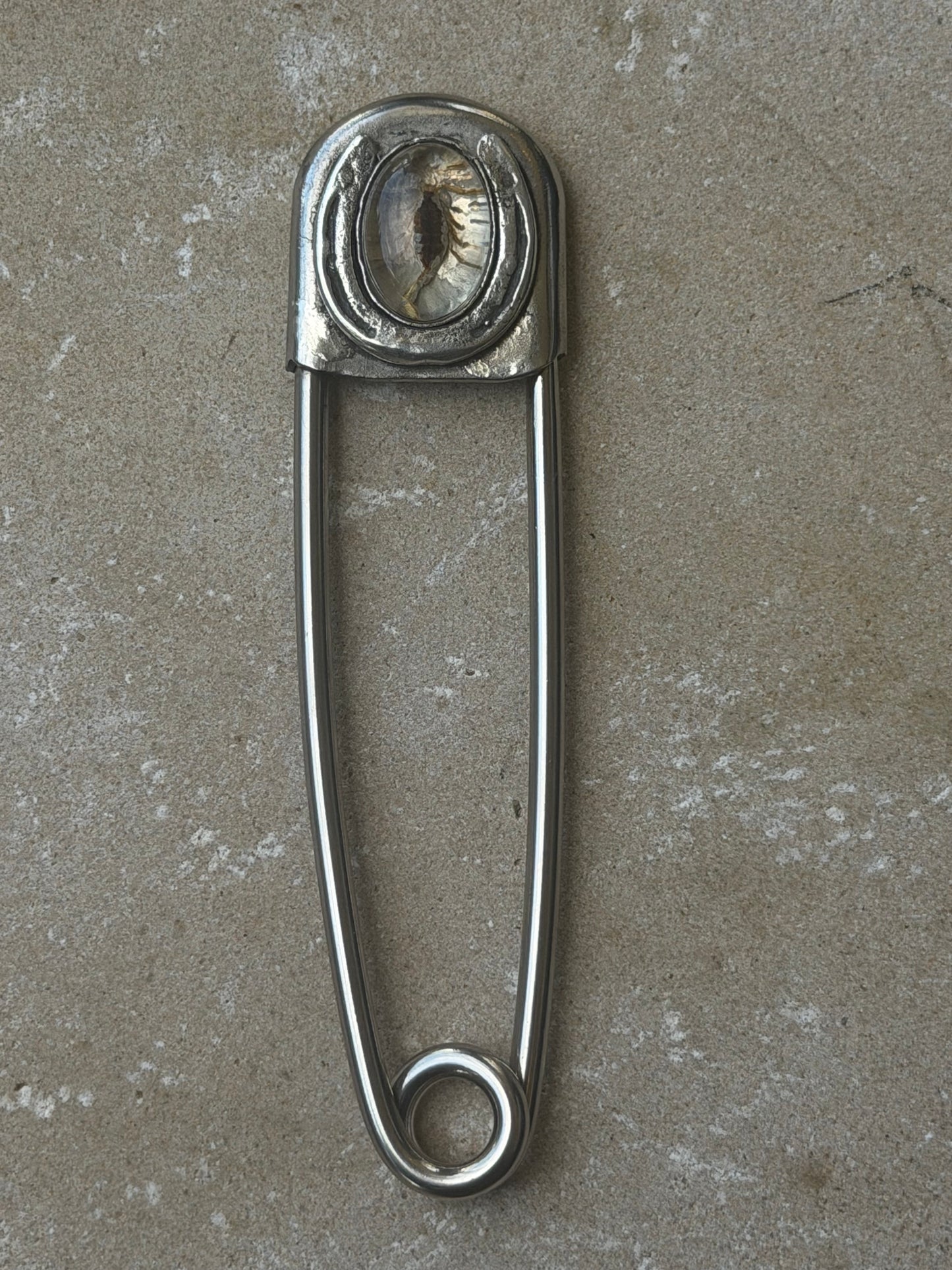 Hard luck scorpion safety pin
