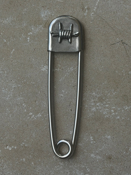 Barbed wire safety pin
